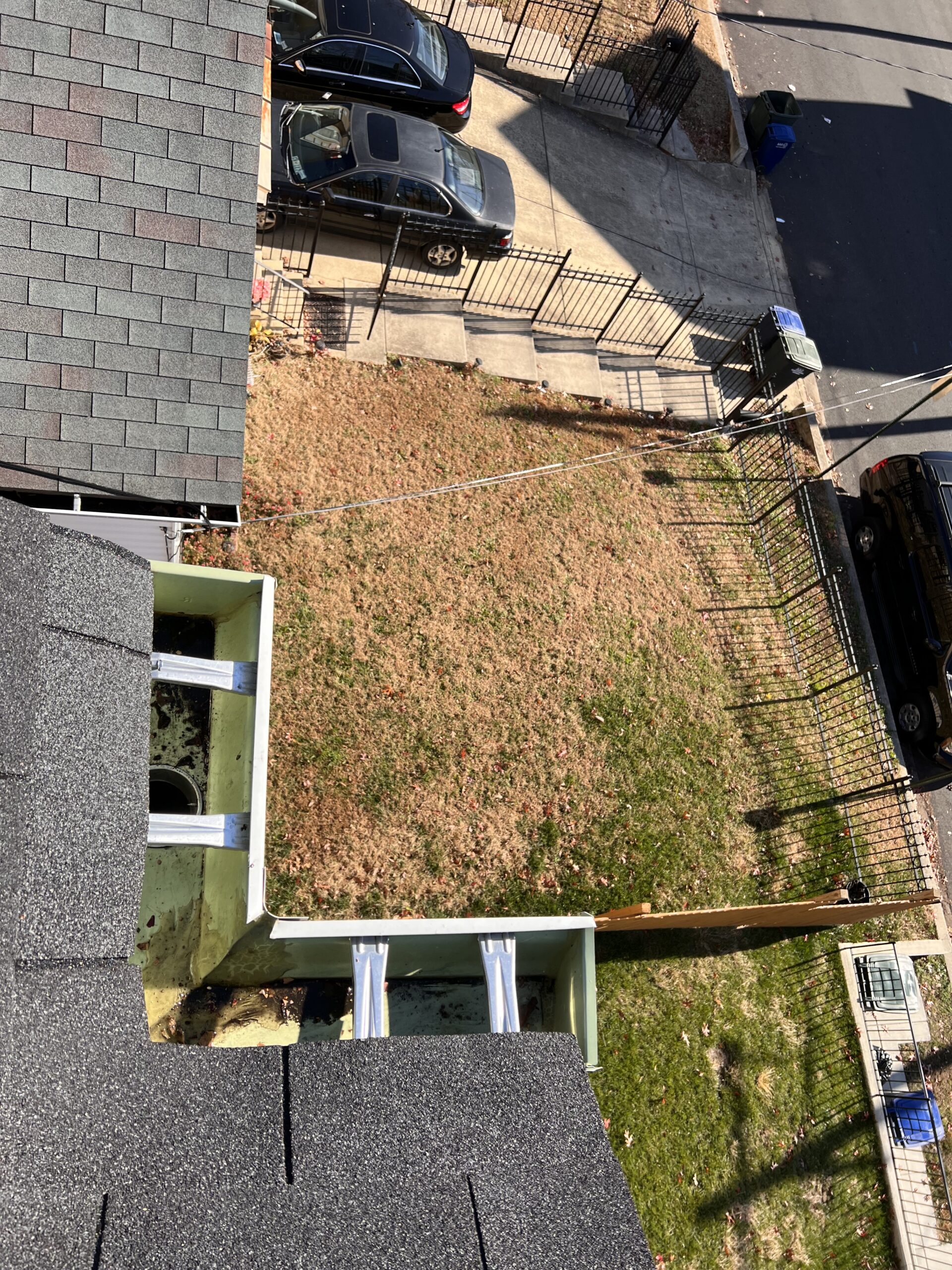 The same gutter valley cleared of debris after cleaning, on a Washington DC rowhouse